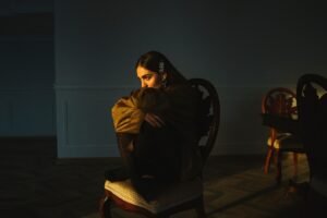 woman sitting on chair inside room